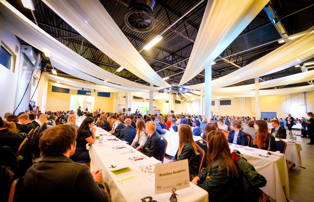 image of hall with young people talking to business people