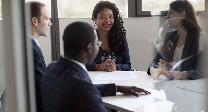 Four-people-in-a-meeting-room