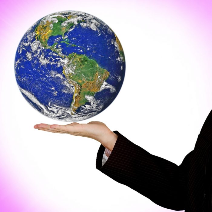 Image-of-hand-holding-globe-of-earth