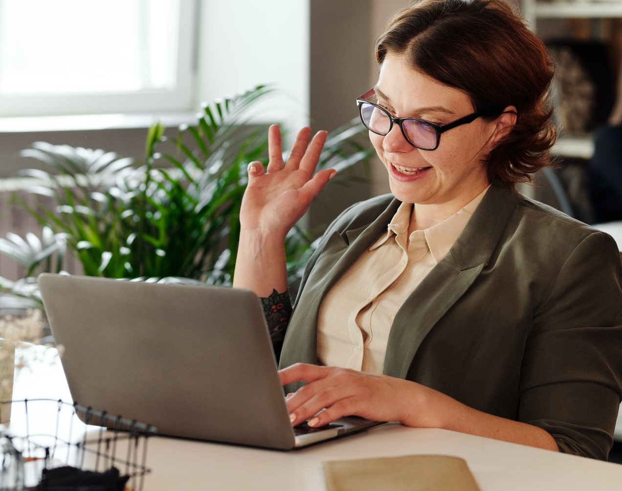 lady-at-laptop-waving-webinar-online-networking