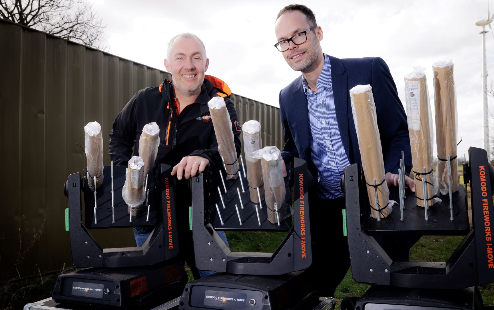 two-males-behind-firework-units