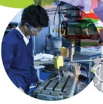 a young Asian man working on a machine