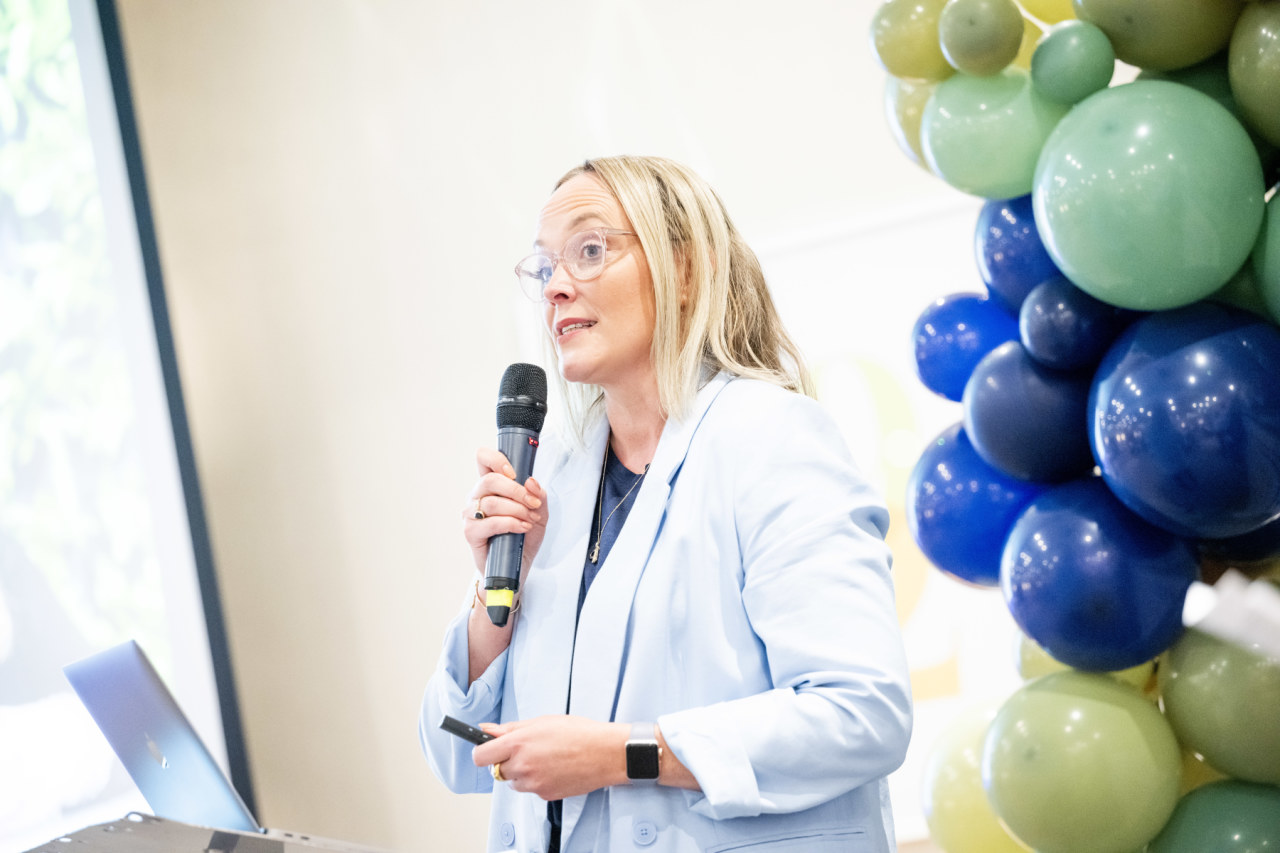 Image of woman with glasses with microphone