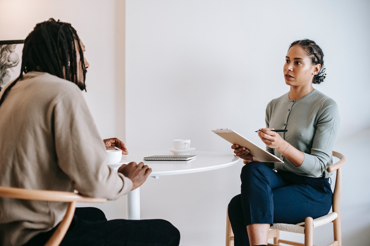 woman interviewing man