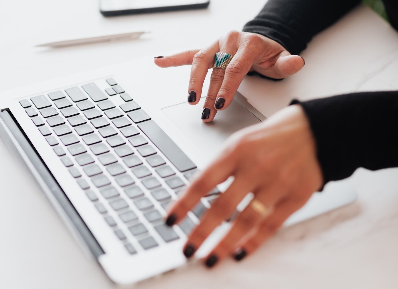 fingers typing on keyboard