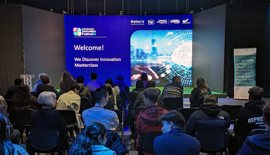 students watching presentation on a screen
