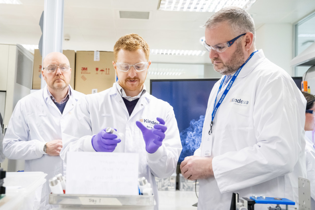 Three men in a laboratory