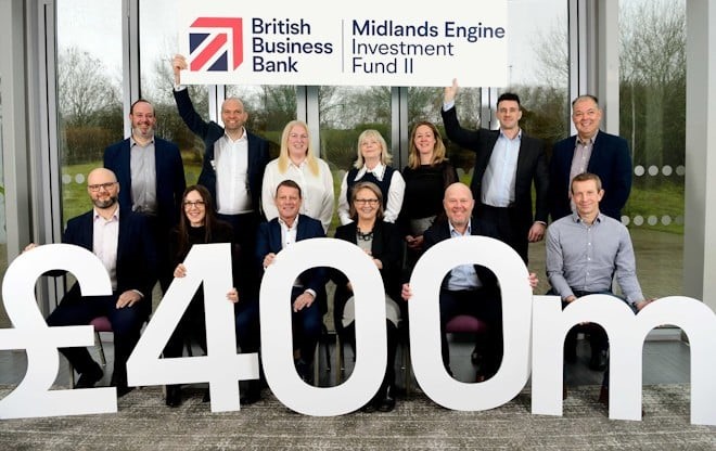 large cut out number £400m with people standing behind