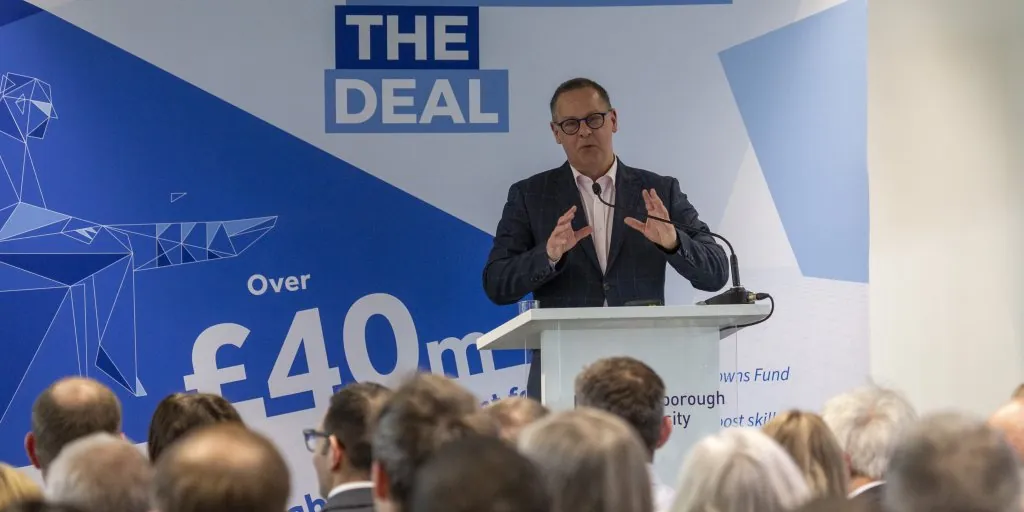 man presenting at podium